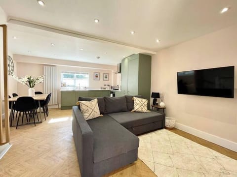 Living room with sofa bed & smart TV
