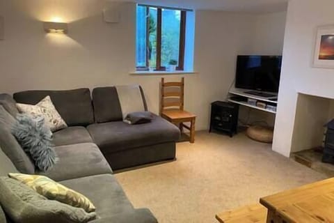 Cosy and comfortable lounge area with TV and Wi-Fi and a very comfy sofa