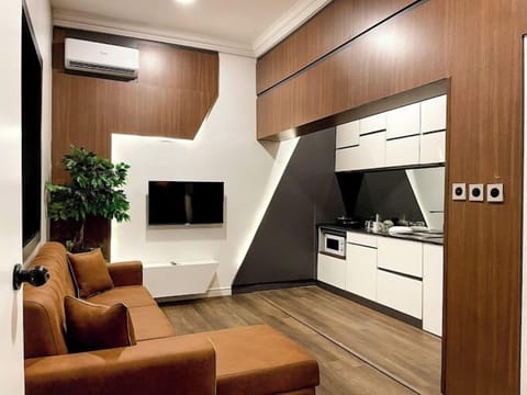 Family Apartment, Balcony, City View | Living area | Flat-screen TV