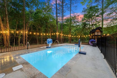 Enjoy an evening swim in the private pool complete with fun water features and string lights.