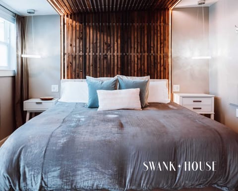 Dreamy king bed with fine linens and sparkling lighting all around. Convenient USB ports at bedside make recharging a breeze.