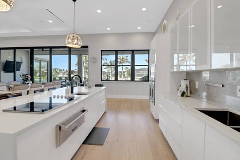 A large pass-thru window opens to the outdoor kitchen, allowing you to create great meals - indoor and out.