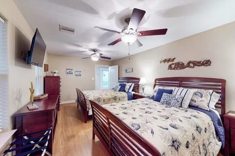 Relax in cozy double queen beds with luxury mattress and Smart TV for unwinding!