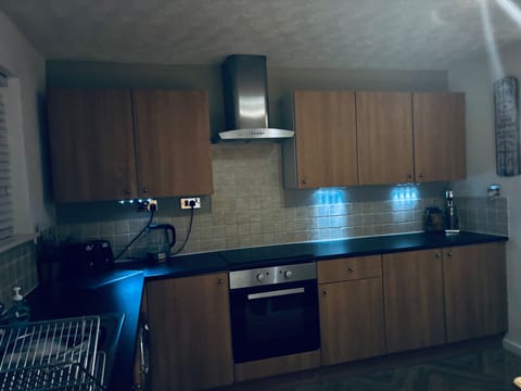 Fully equipped kitchen, oven with hob, kettle, toaster, milkshake machine & microwave.