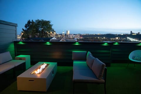 Skyline rooftop terrace with gas fire pit & ambient LED lighting