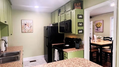 Modern kitchen with new stainless steel appliances. Granite countertops.