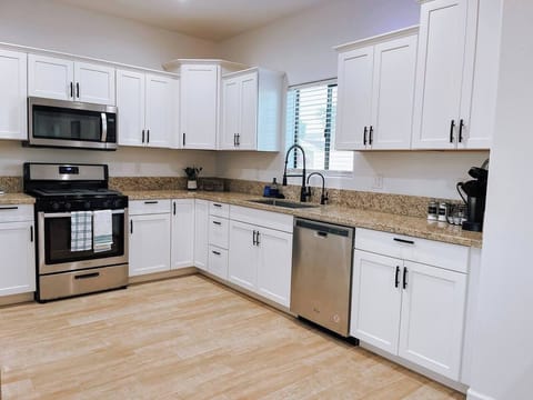 Fully equipped kitchen with modern appliances and ample counter space