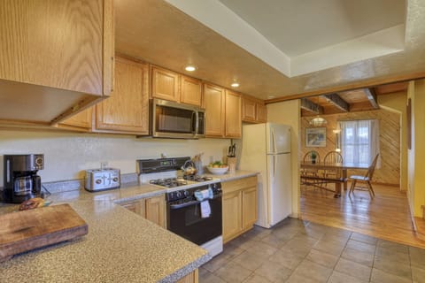 Great flow from this fully stocked kitchen into the dining room