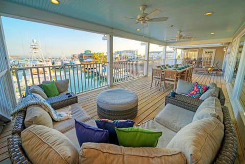 Shaded outdoor patio with marina views.