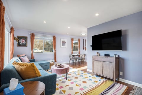 Cozy up in the living room with a 55” TV and lots of style!