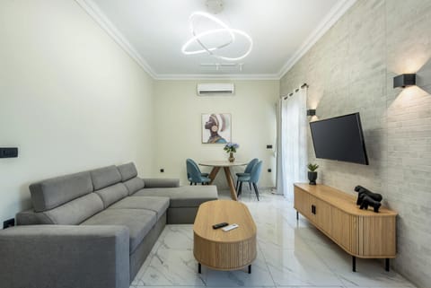 Luxury Apartment, City View | Living area | 43-inch Smart TV with cable channels