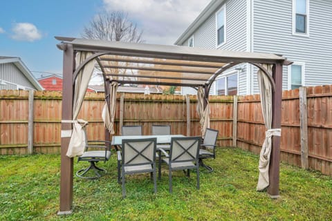 Dine alfresco or unwind in the fresh air under the backyard pergola