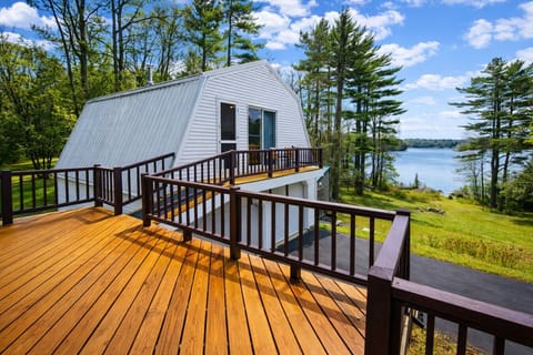 Spacious lakeview deck overlooking the water, perfect for morning coffee, outdoor dining, and relaxing in a peaceful setting.