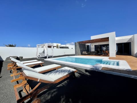Private pool with spacious terrace and pergola.