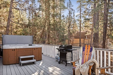 Brand new hot tub along with a gas BBQ out on the deck immersed in nature.