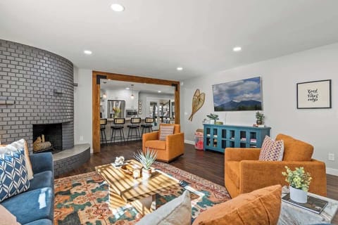 Relax by the Fireplace in This Stylish, Cozy Living Space