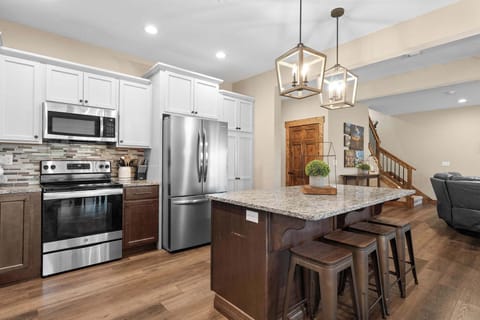 The cabinets are stocked with all the pots, pans, utensils, and small appliances you would need to cook up your favorites!