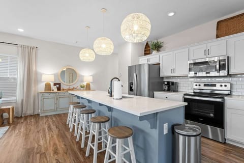 The oversized island is a great spot to cook and serve up food for your large group!