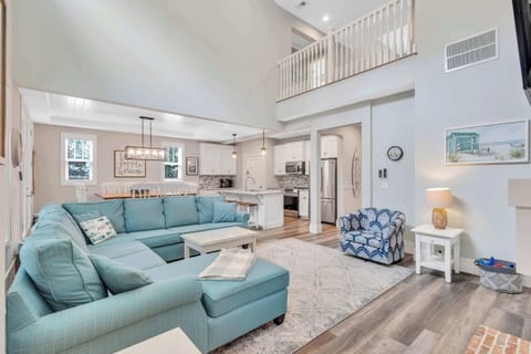 The family room beautifully combines comfort and style, boasting a large sectional that can accommodate the whole family. Whether you're lounging for a casual afternoon or gathering for an evening of entertainment, this room is perfect for you