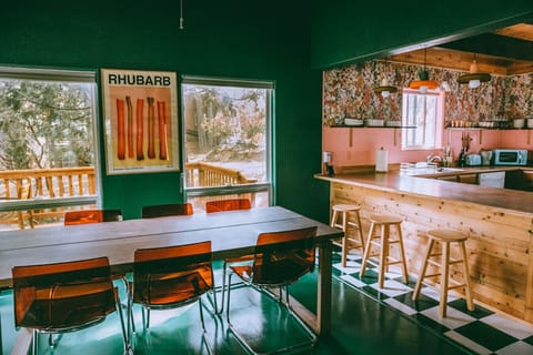 The dining table seats 6 and the bar seats 3 for a total of 9 seats.