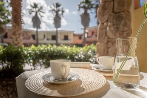 Apartment, Balcony, Pool View | Outdoor dining