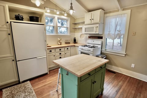 The Kitchen ~ Gas Stove, Microwave, Refrigerator, Butcher Block Counter Tops
