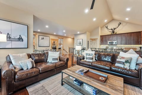 Living Room: 2 leather couches, 65” Smart TV with advanced cable, gas fireplace
