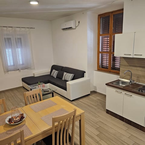 Comfort Apartment, 2 Bedrooms | Living area | Flat-screen TV