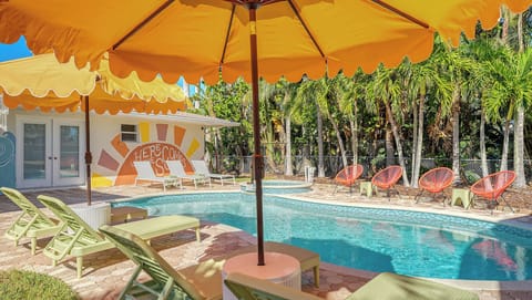 Spacious backyard with a lanai, heated saltwater pool, and spa. Perfect for gatherings or relaxing. We provide all the pool towels you'll need for your stay.