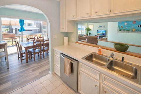 Bright Coastal Kitchen + Dining | Balcony Views | Steps to Beach + Shops