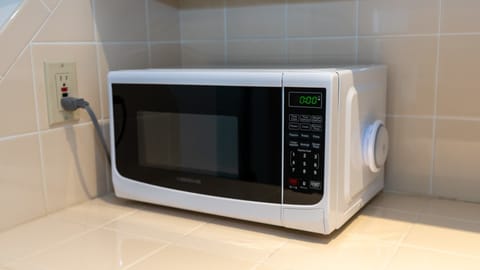 Enjoy quick snacks or easy meals with this modern countertop microwave—perfect for reheating leftovers or popping popcorn during your coastal escape. Convenient, clean, and ready for guest use.