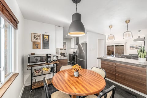Bright and inviting breakfast nook just off the kitchen, offering a perfect spot for casual meals or enjoying a quiet moment.