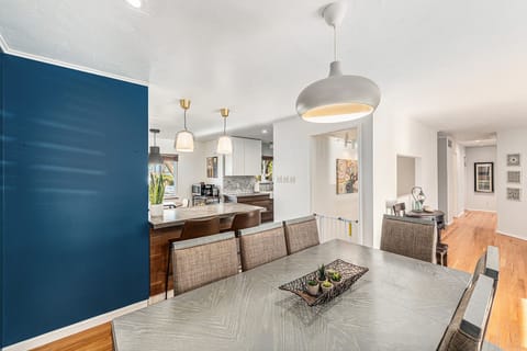 Spacious dining area seamlessly opens to the kitchen, creating the perfect space for meals and entertaining.