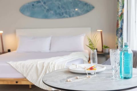 Enjoy your stylish studio featuring a comfortable king bed, split AC, and ocean and city views from your window.