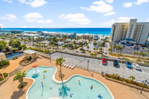 View of the outdoor pool area with ocean in the background
