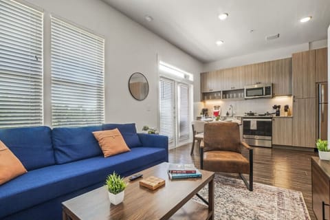 You feel at home as you settle into the living room, where the inviting atmosphere is perfect for lounging or entertaining.