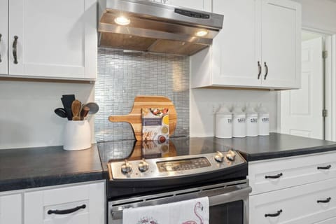 Cook with ease using the sleek electric oven, surrounded by stylish details and plenty of counter space.