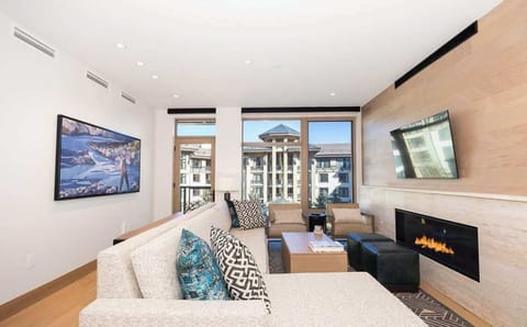 462 - Living rom with gas fireplace, outdoor balcony with seating