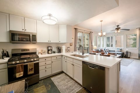 Fully stocked kitchen with open floor plan that is great for entertaining!
