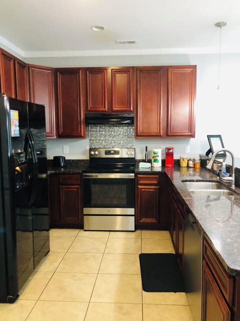 Fully stocked kitchen with modern appliances for home-cooked meals