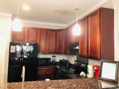 Granite countertops and bar seating perfect for entertaining