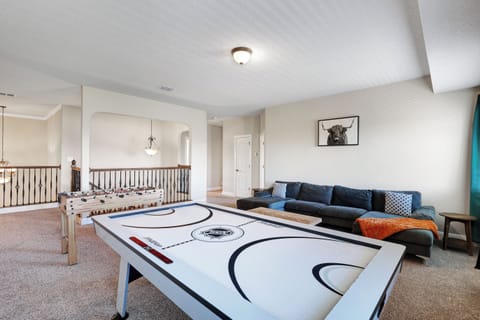 Game room with air hockey, ping pong, and foosball tables!