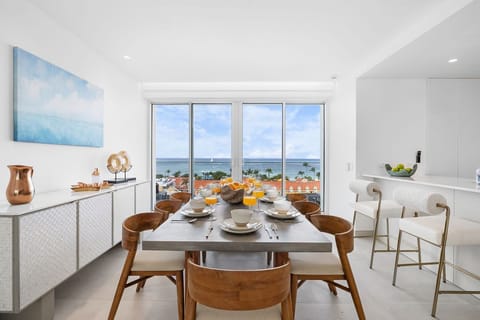 Wake up to fresh juice and tropical views from your elegant dining space, where mornings become an experience. The open kitchen flows seamlessly, making every meal feel effortless and bright.
