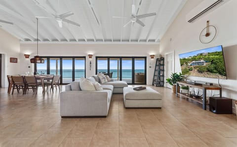 Oceanfront Villa Terrace with Caribbean Views Expansive oceanfront terrace overlooking the Caribbean Sea — your perfect spot for sunrise coffee or evening cocktails.