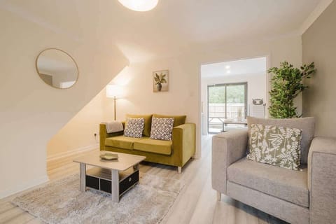Settle into the comfy sofa and armchair for a perfect evening of relaxation in front of the large TV