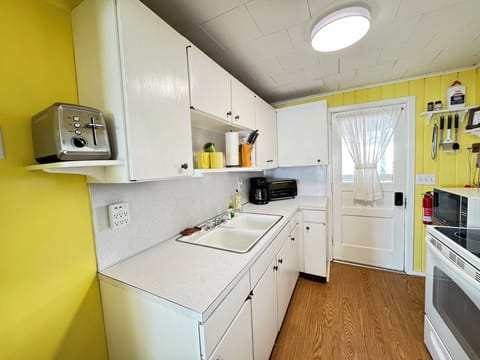 Equipped Kitchen with Typical Utensils, Pots, Pans, Dishes & Glasses