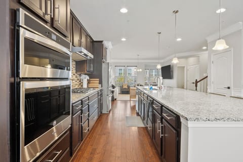 Stocked gourmet kitchen with amble space