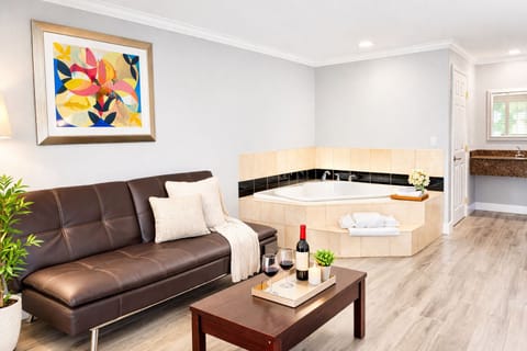 Premium Suite, 1 King Bed, Non Smoking, Jetted Tub | Desk, laptop workspace, iron/ironing board, free WiFi