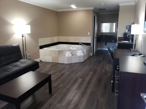 Suite, 1 King Bed, Non Smoking, Jetted Tub | Desk, laptop workspace, iron/ironing board, free WiFi