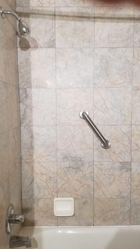 Room, 1 King Bed | Bathroom | Combined shower/tub, free toiletries, hair dryer, towels